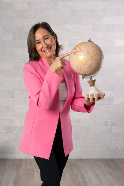 Dr. Doris Ferres holding a globe